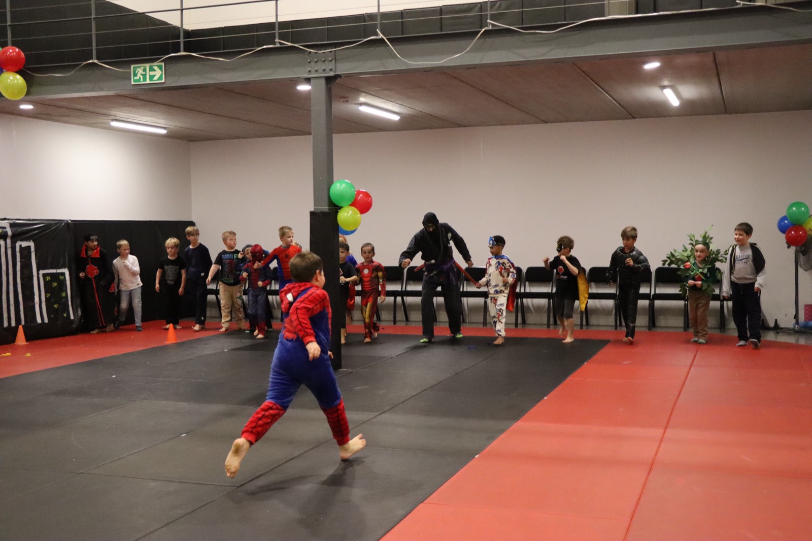 Kids in superhero costumes at Heroes Night Out